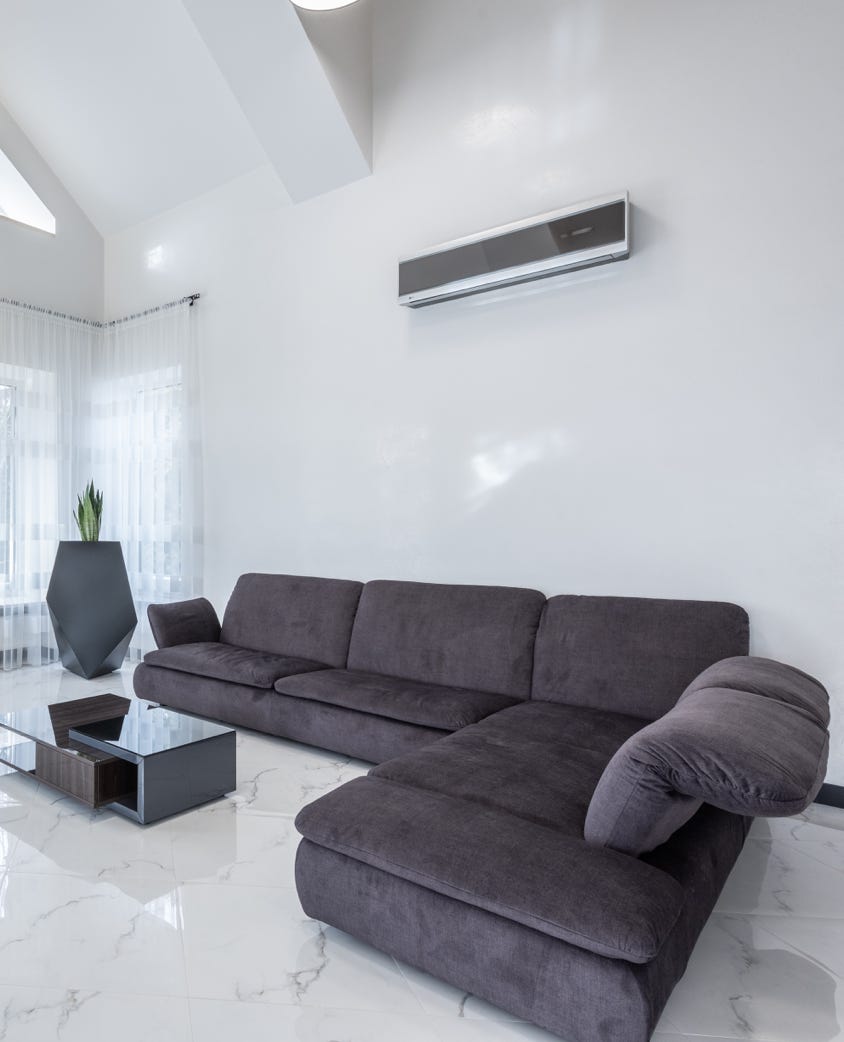 Cozy living room with comfortable sofa and minimalist furniture