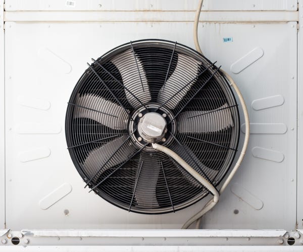 Frying steaks on grill rack in smoke
